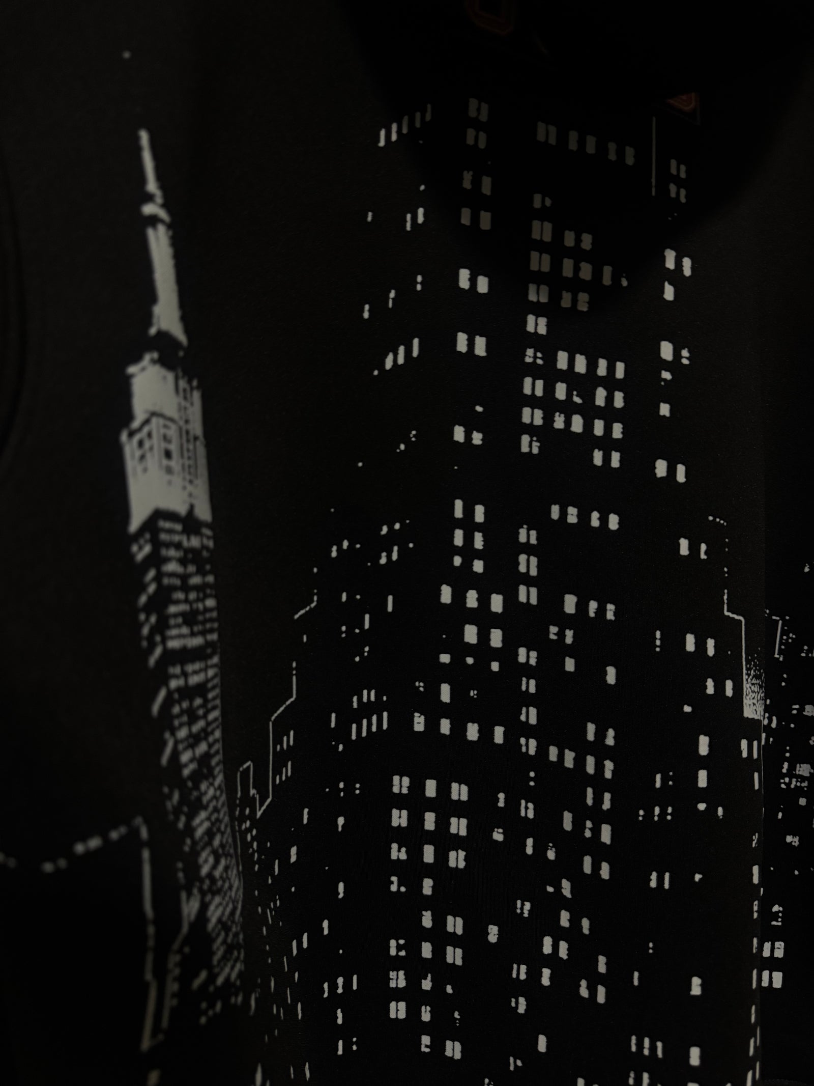 Detail of the city skyline print on the Built Beyond Comfort hoodie