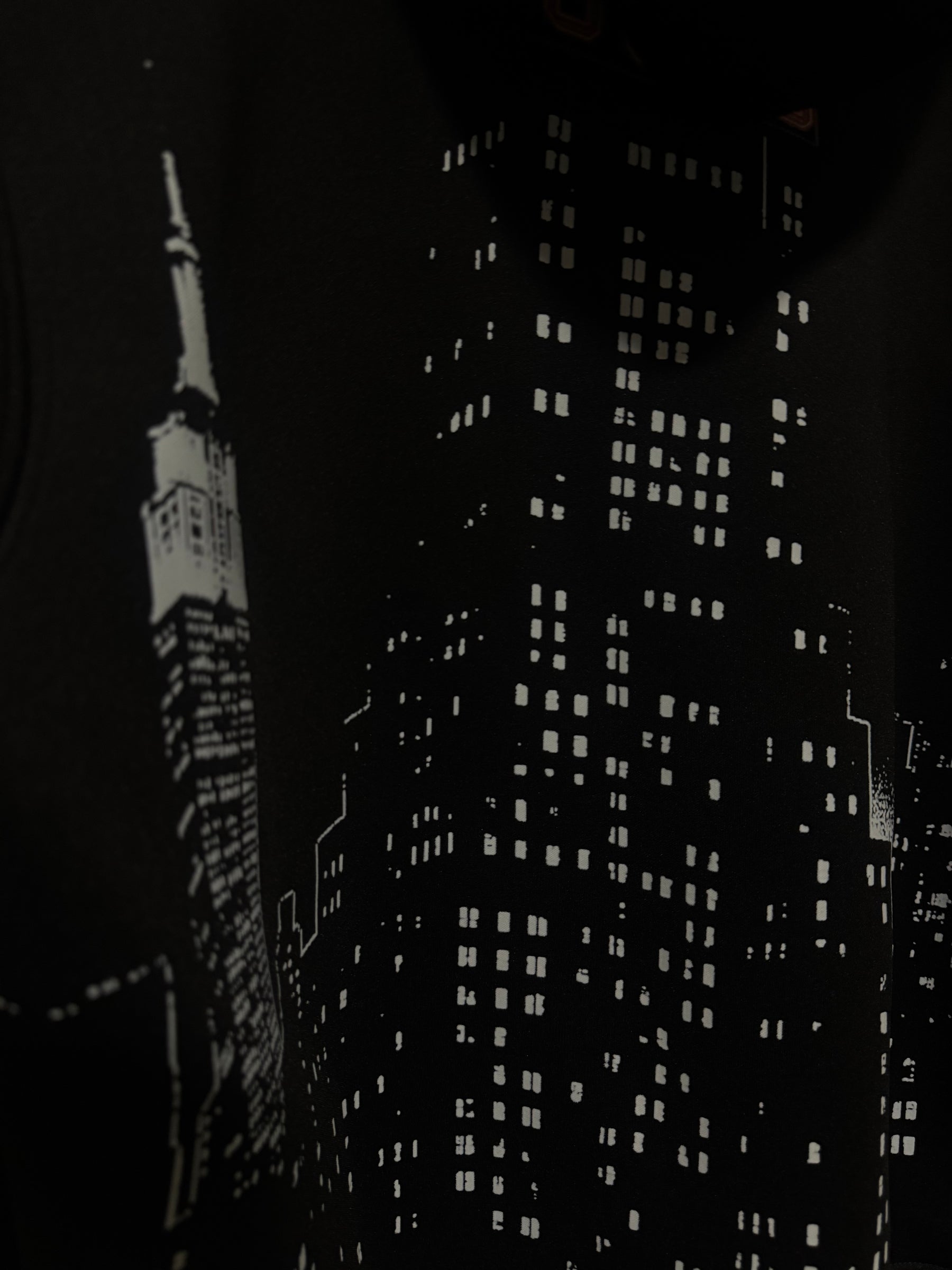 Detail of the city skyline print on the Built Beyond Comfort hoodie